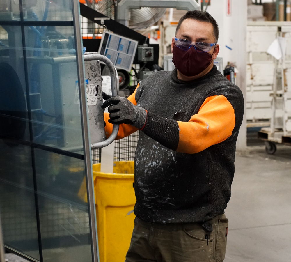 Employee enjoying work in his facemask